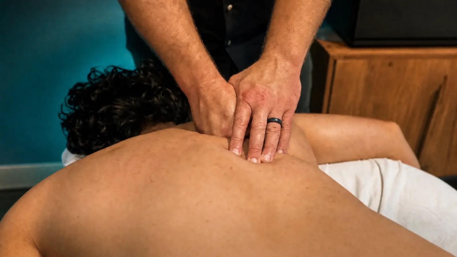 medical massage session targeting lower back muscle tension in Palatine IL
